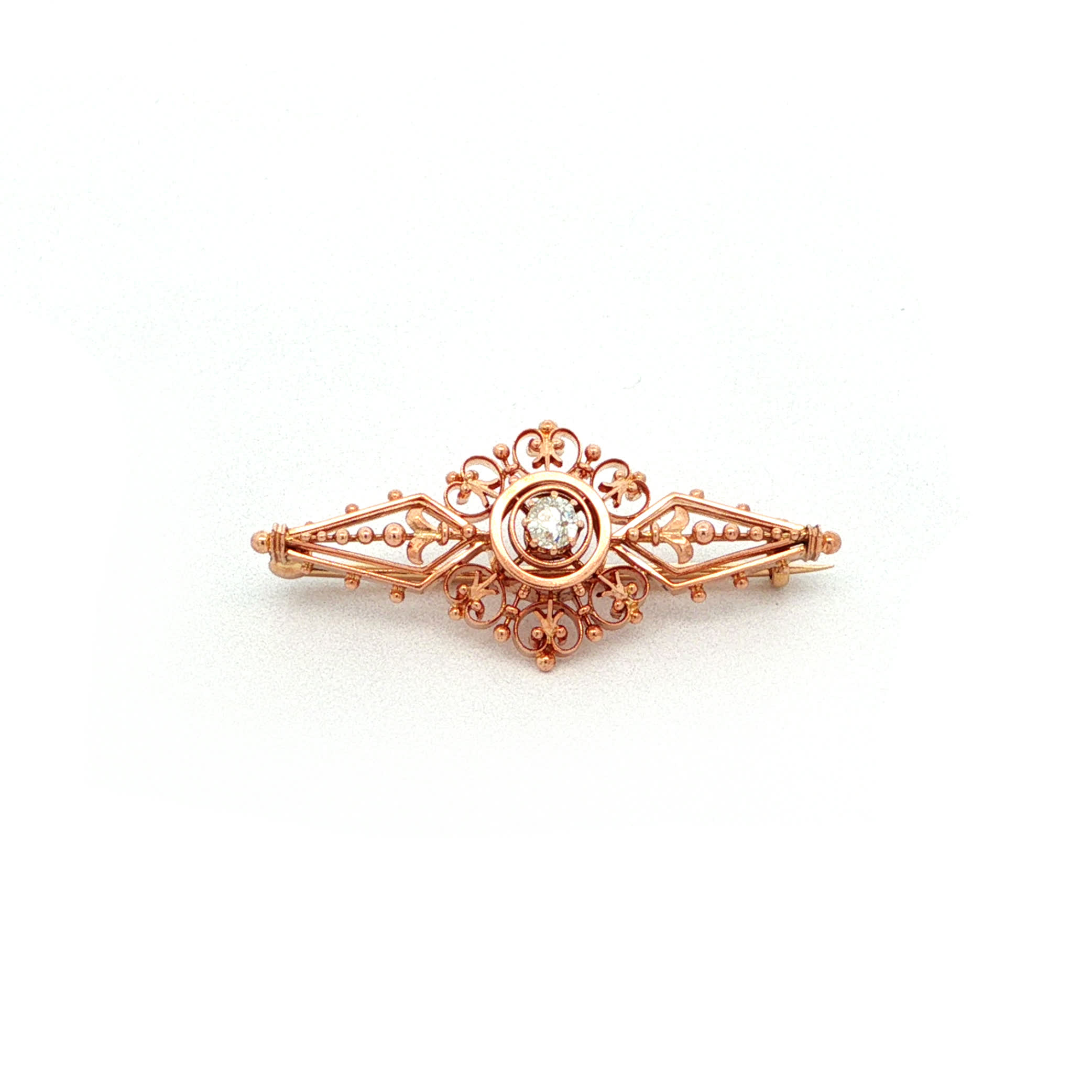"Petite Arabesque" - Antike Brosche in 14kt Rosegold mit Diamant im Altschliff - Juwelier Steiger
